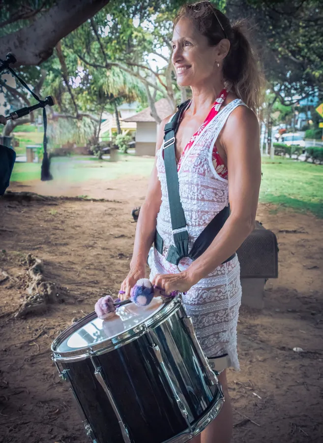 A smiling drummer with a snare drum